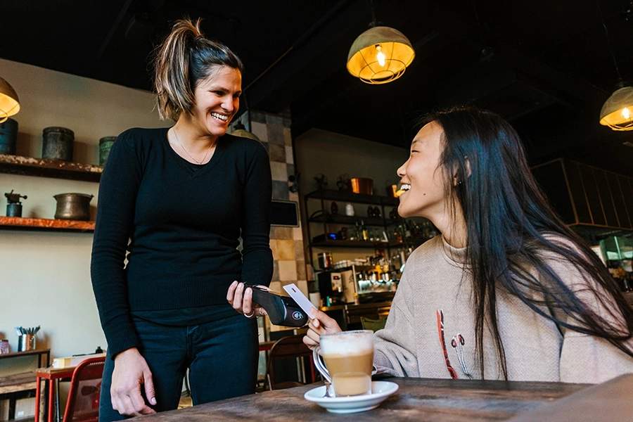 Two friends chatting over coffee